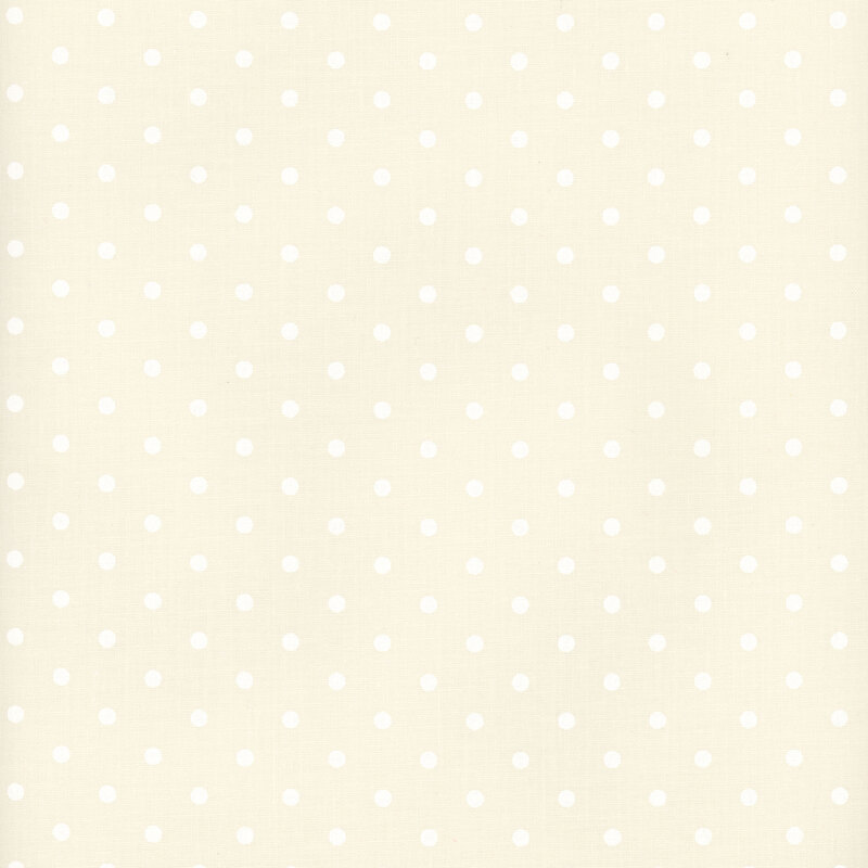 White polka dot print on cream fabric