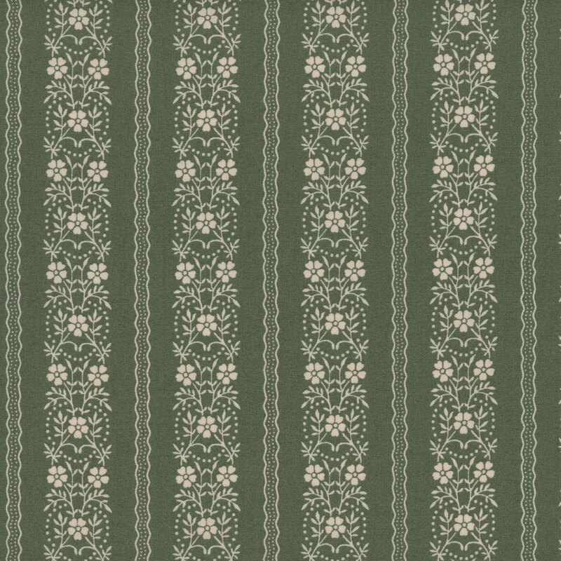 Green fabric with rows of cream wavy lines and cream floral vines arranged in rows