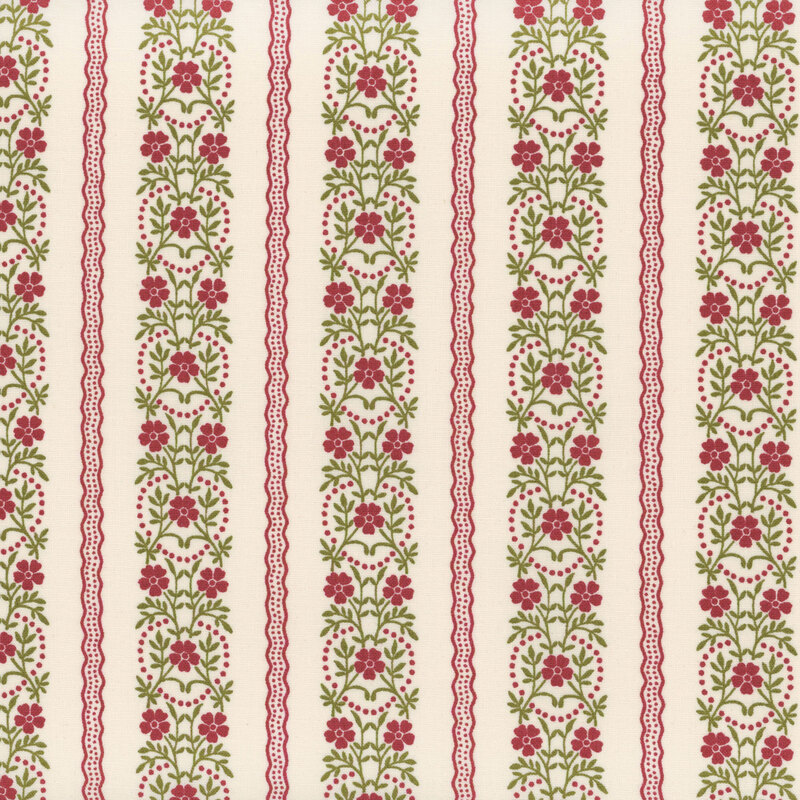 White fabric with rows of red wavy lines and green floral vines with red flowers arranged in rows