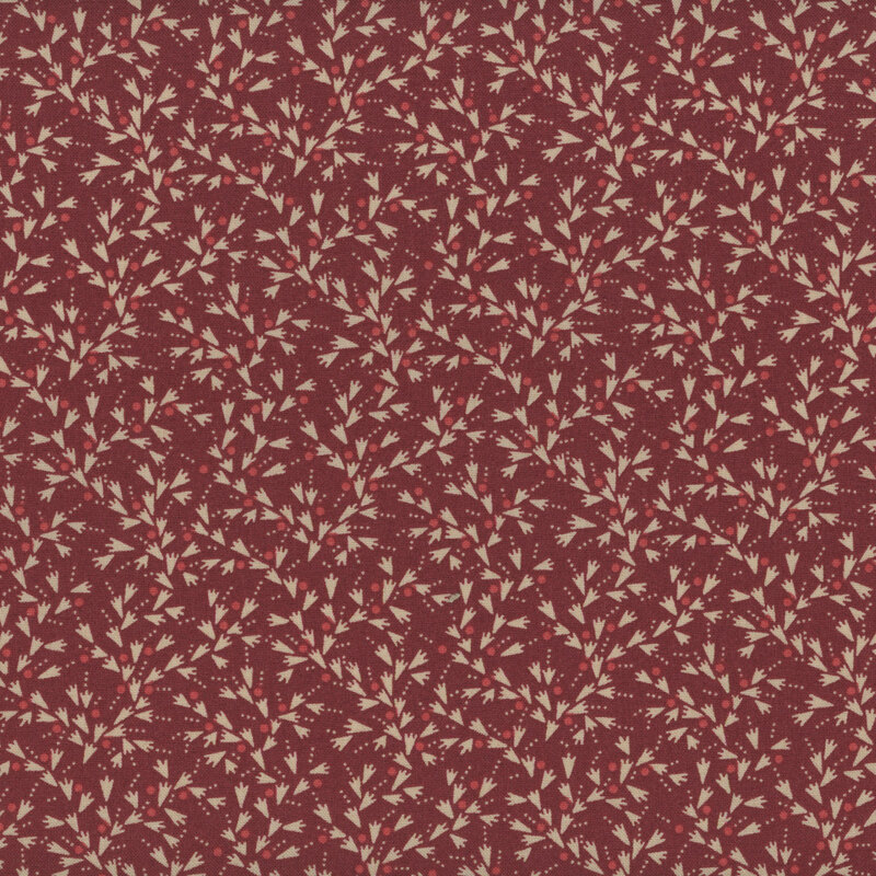 Burgundy fabric with tiny cream wedge shapes with red dot accents