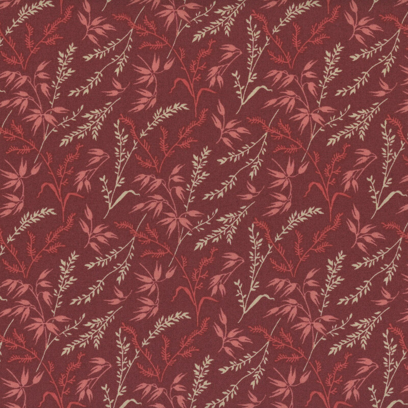 dark red fabric with flowering grass stalks in lighter shades of red and cream