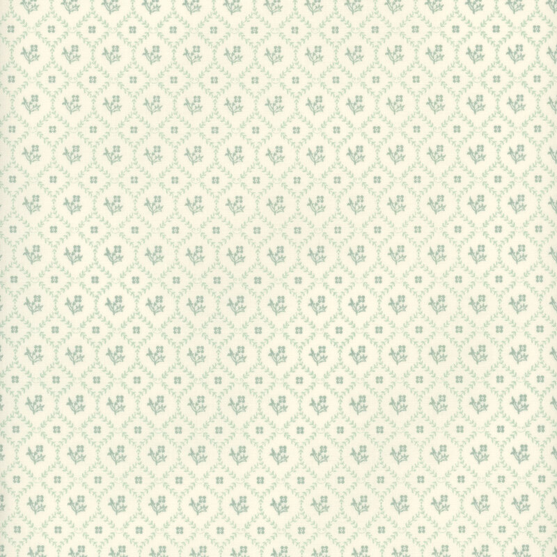 lattice grid made of aqua leaves with florals and square motifs inside each square on a cream fabric