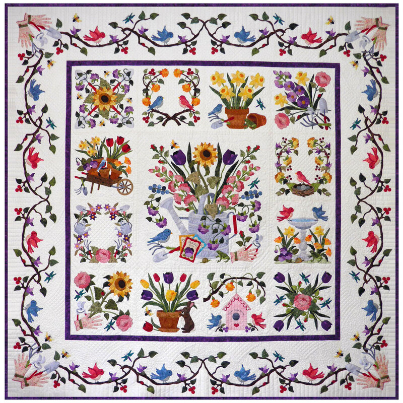 Head on shot of the finished Baltimore Spring quilt, very detailed and tiny pieces coming together to evoke a garden in full bloom
