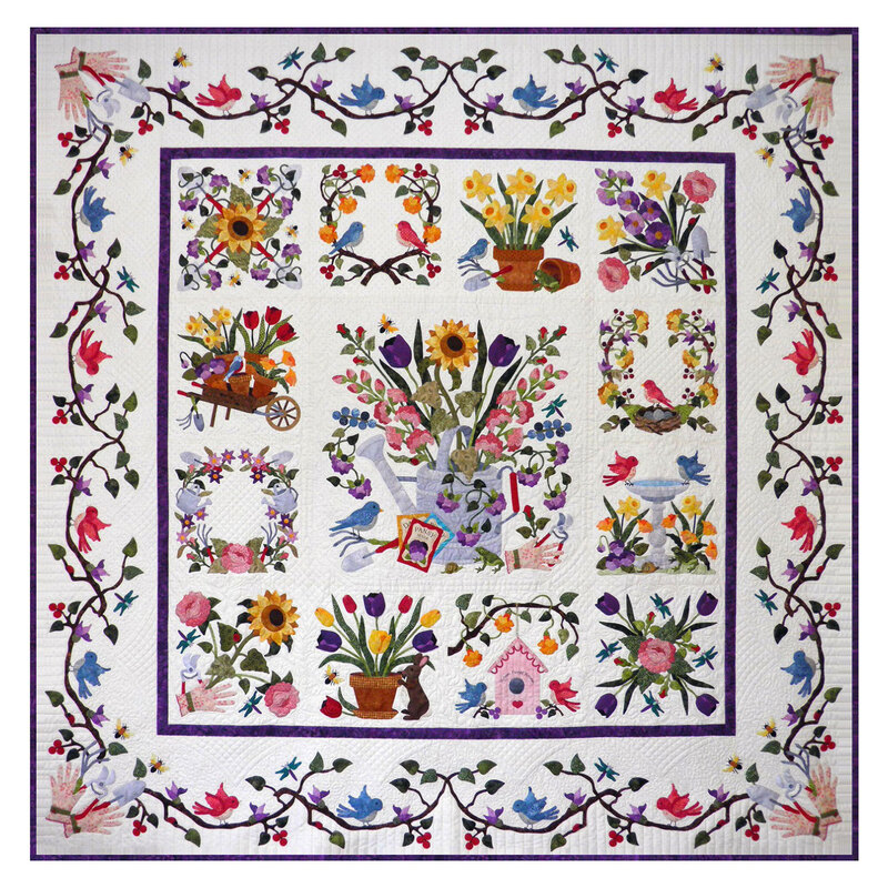 Head on shot of the finished Baltimore Spring quilt, very detailed and tiny pieces coming together to evoke a garden in full bloom