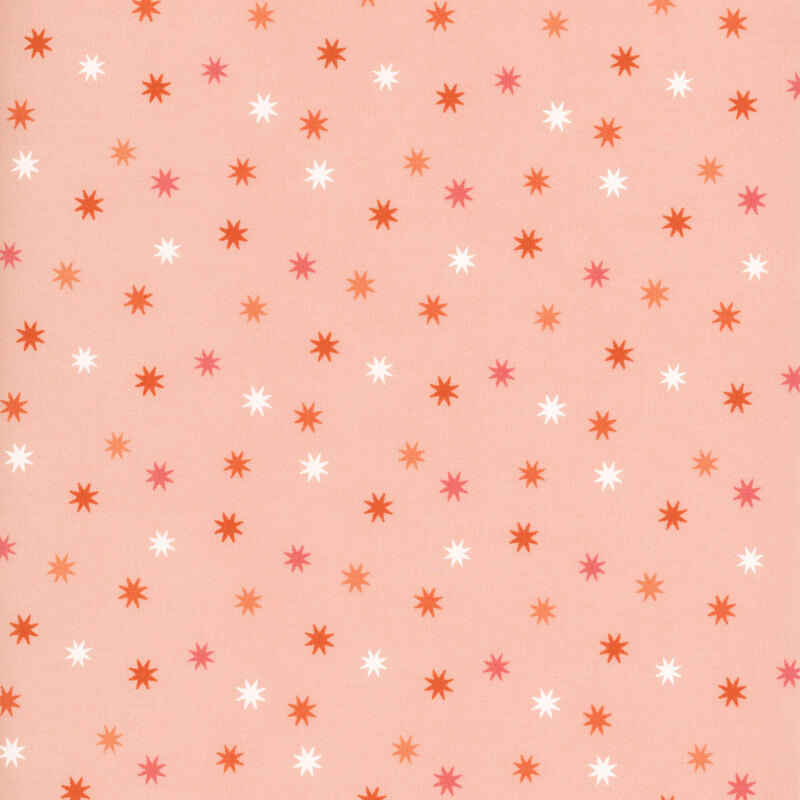 adorable peachy pink fabric with scattered dark pink, orange, and white stars