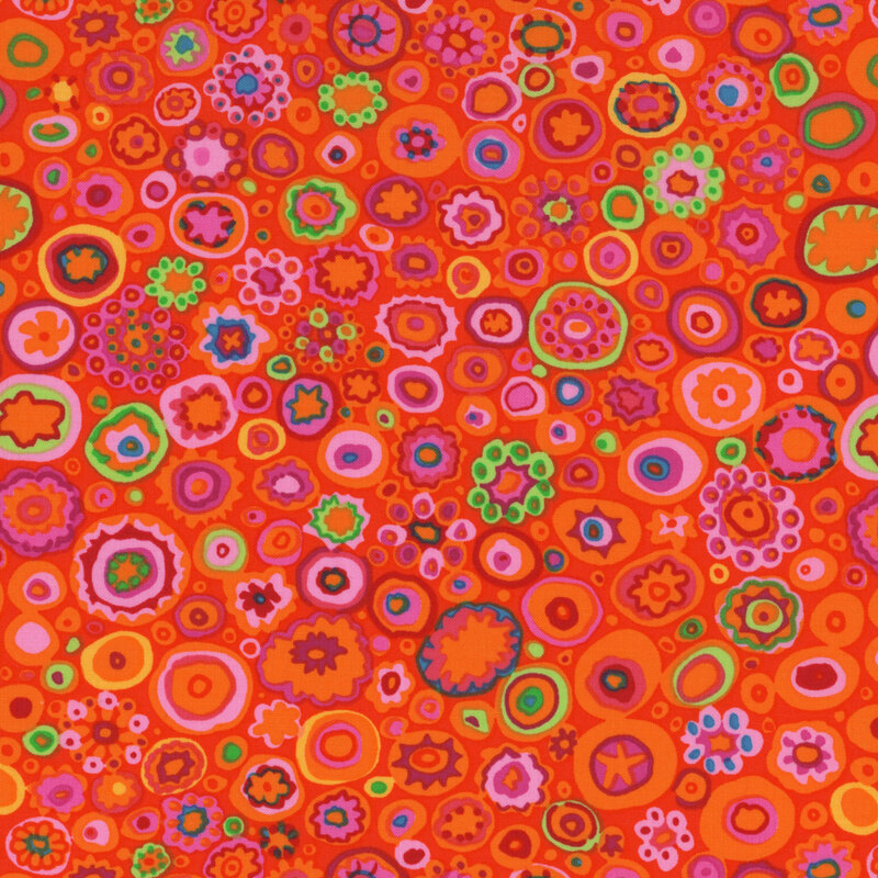 Fabric featuring a vibrant rainbow of colorful stylized circles packed together over an orange background