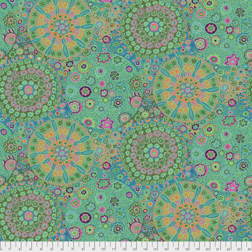 fabric featuring vibrant teal, aqua, orange, and purple kaleidoscopic abstract shapes