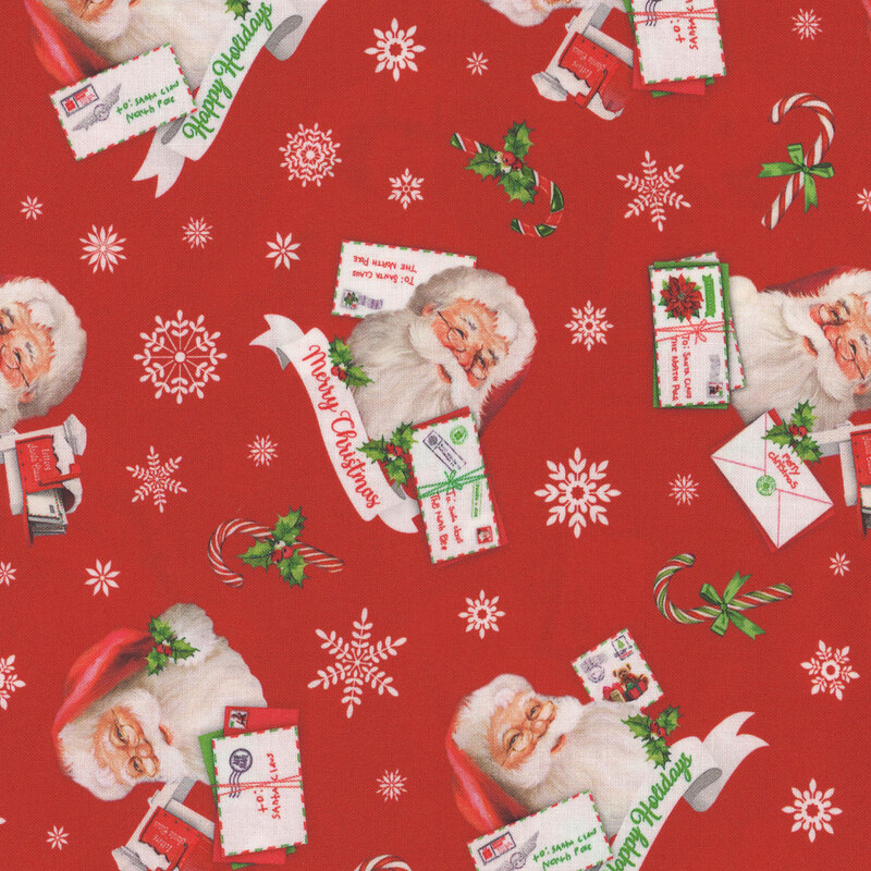 Santa cameos and tossed candy canes and snowflakes on red fabric.