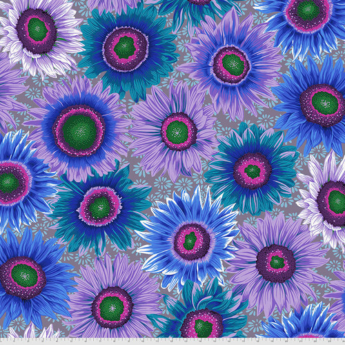 Fabric featuring vibrant blue, teal, and purple sunflowers over a muted purple background