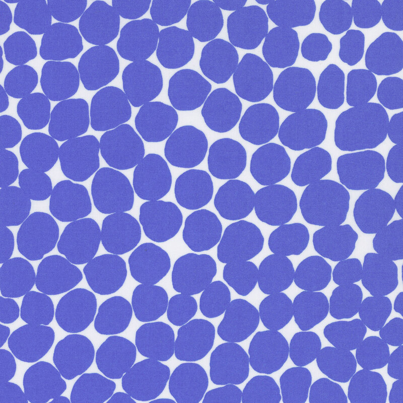 Fabric featuring vibrant blue abstract dots over a white background