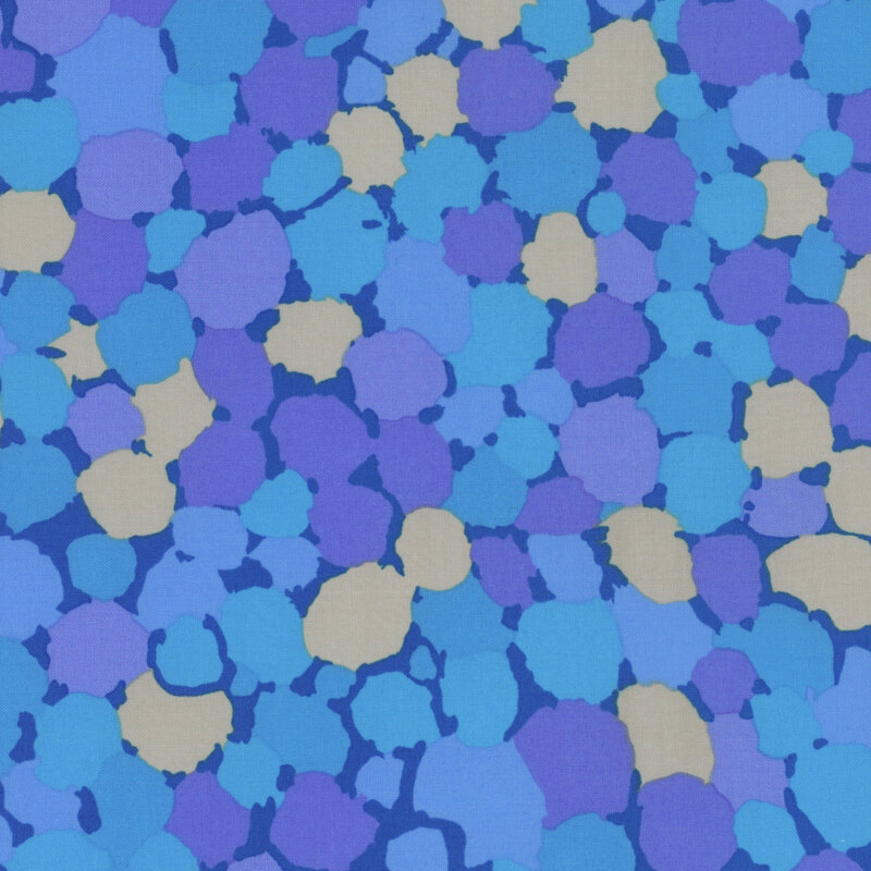 Fabric featuring vibrant blue, periwinkle, and taupe abstract dots over a blue background