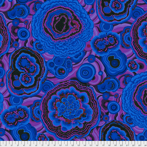Fabric featuring vibrant blue, black, and purple agate designs over a swirling purple background