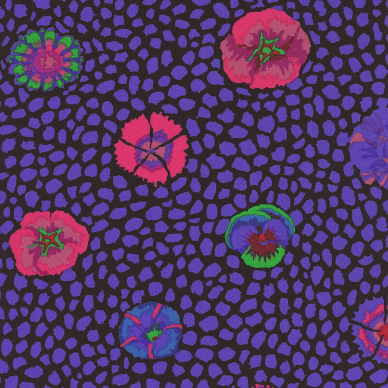 Fabric featuring vivid navy blue dot texturing and bright green, pink, purple, and blue blossoms over a black background