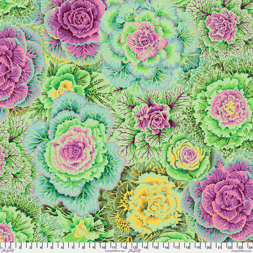 Fabric featuring vibrant green, yellow, and purple cabbages