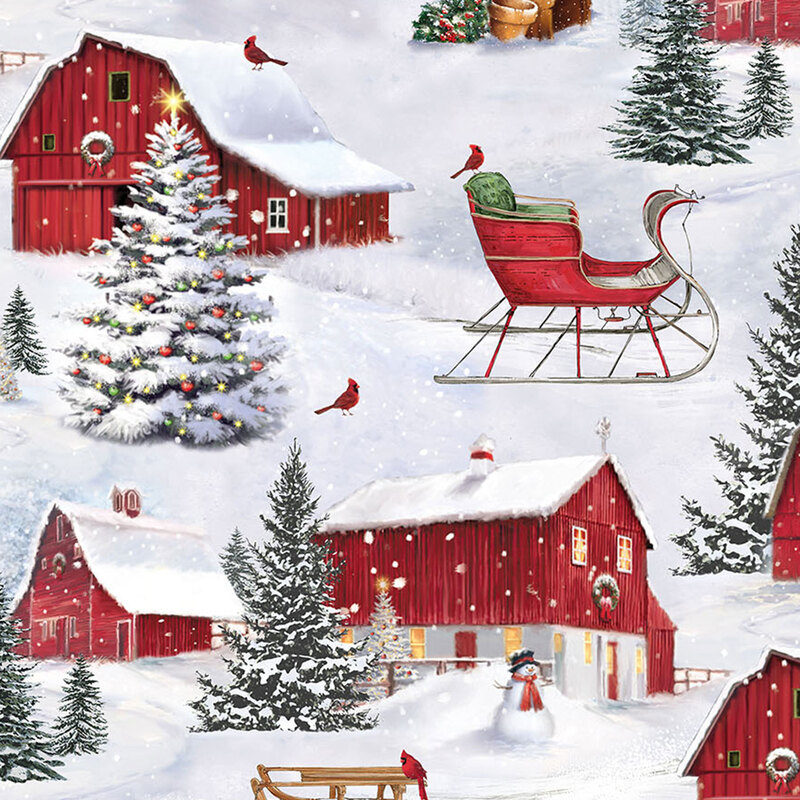 Fabric with a snowy scene of red barns, cardinals and sleds, snowmen, and Christmas trees.