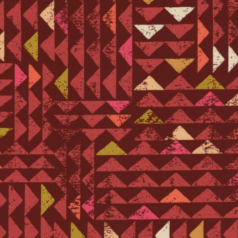 maroon fabric with a beautiful textured triangle design in cream, pink, white, dusty red, and mustard yellow