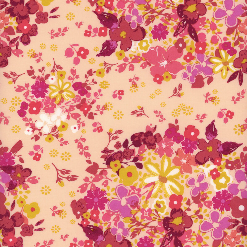 light pink fabric with a gorgeous design of scattered and packed florals in shades of purple, pink, magenta, white, and mustard yellow