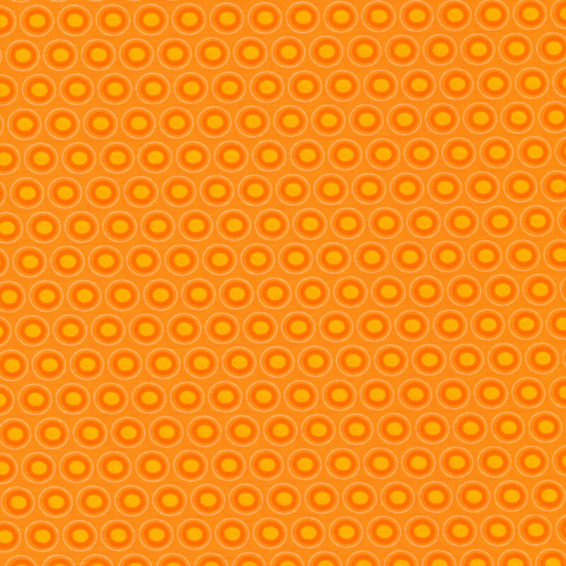Bright orange fabric with a lovely orange and golden yellow oval polka dot design