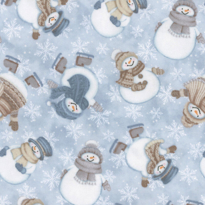 Cute snowmen in various winter outfits, and white snowflakes on pastel blue fabric.