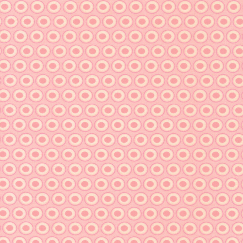 pastel pink fabric with a lovely white and bubblegum pink oval polka dot design
