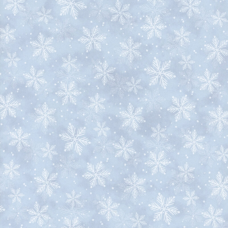 White snowflakes against a pastel blue mottled fabric.