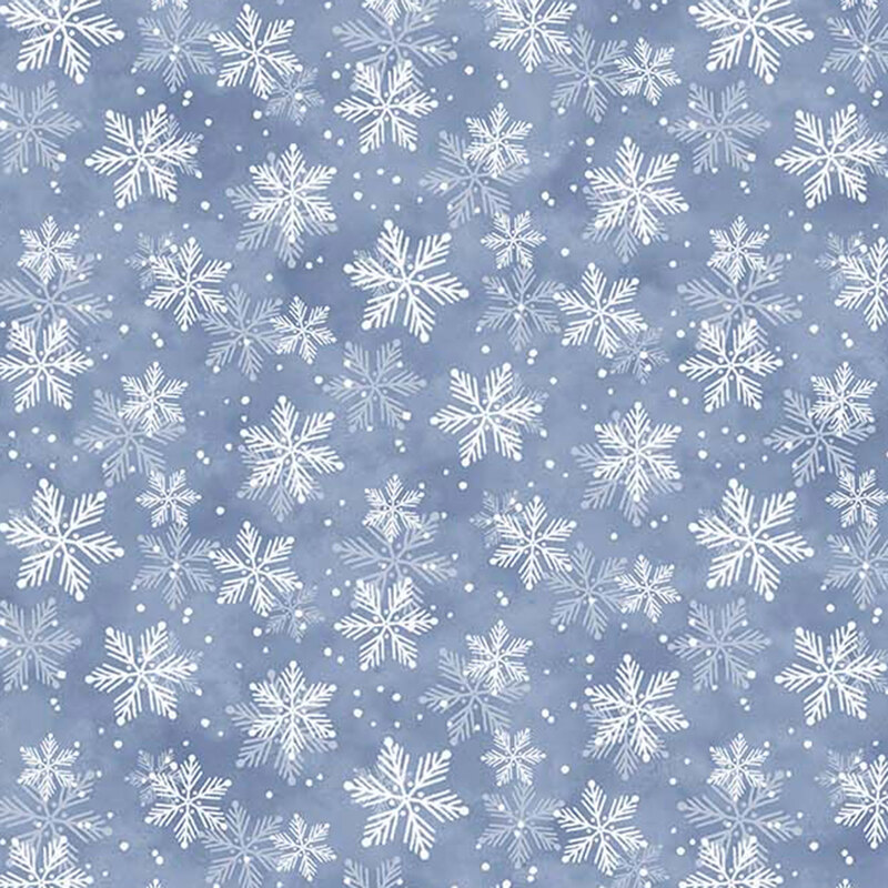 White snowflakes against a blue mottled fabric.
