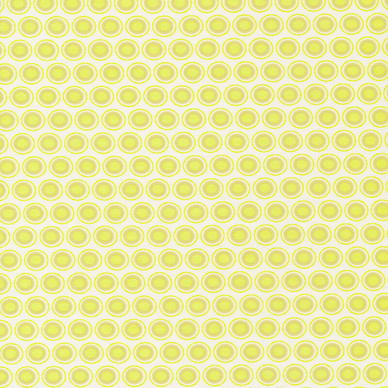 off white fabric with a tan and chartreuse oval polka dot design