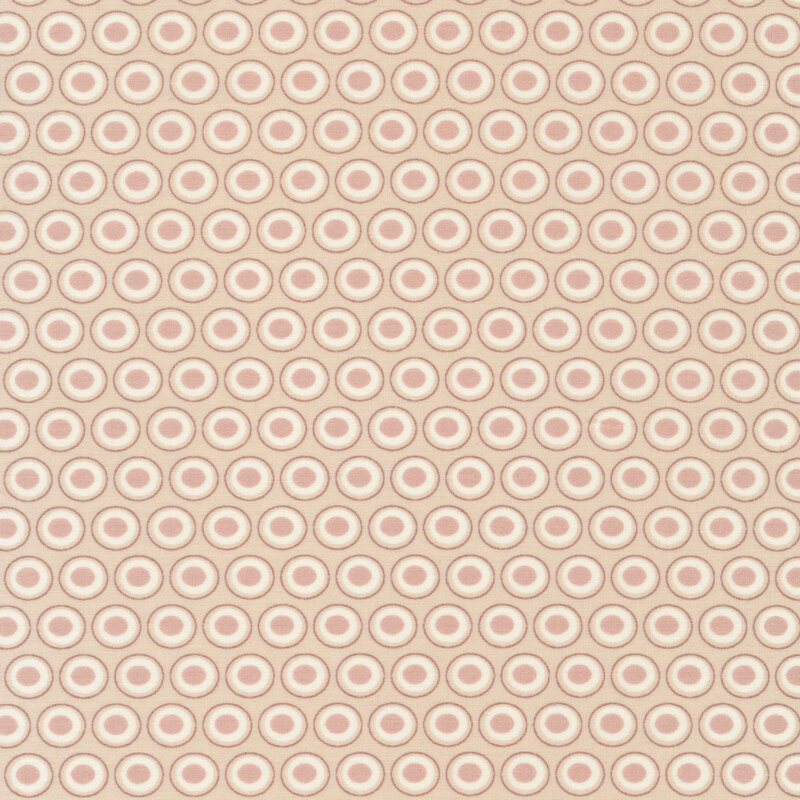 cream fabric with a white and light brown oval polka dot design