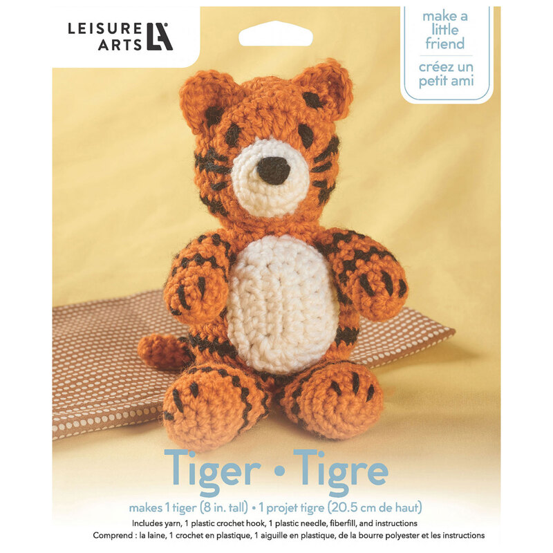 Front of the kit, showing the complete crocheted tiger staged in front of coordinating, folded up fabric