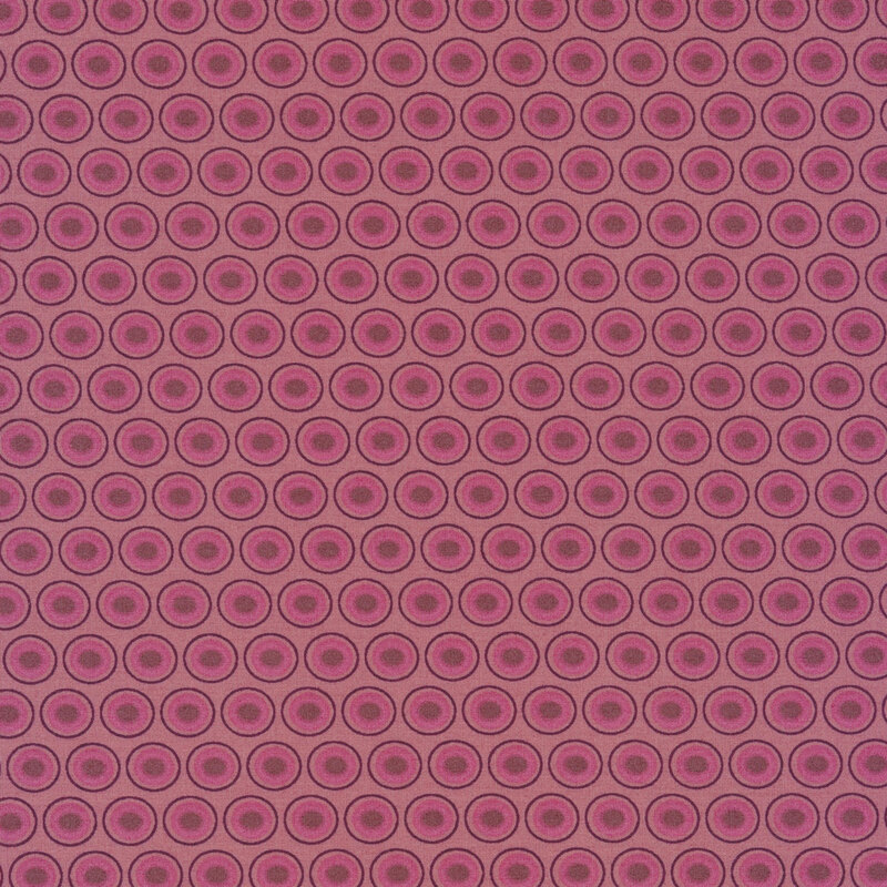 Pink mauve fabric with a lovely fuschia and plum oval polka dot design