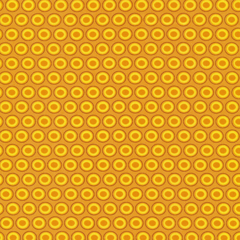 golden yellow fabric with a lovely bright yellow and mustard oval polka dot design