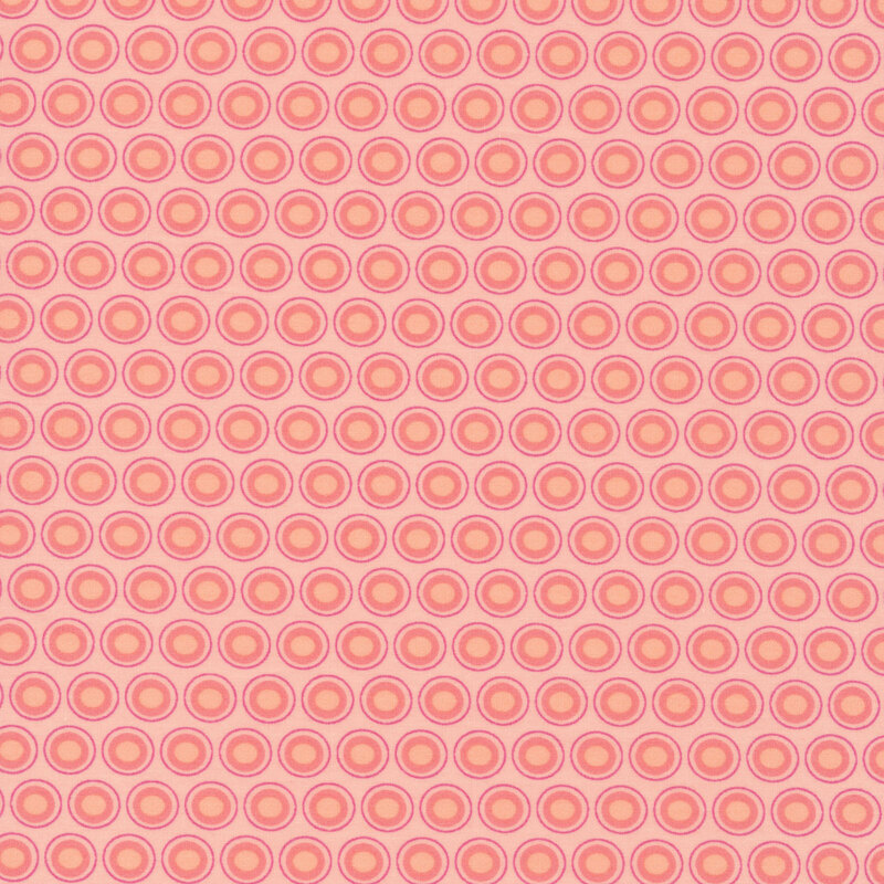 Baby pink fabric with a lovely pink and champagne pink oval polka dot design
