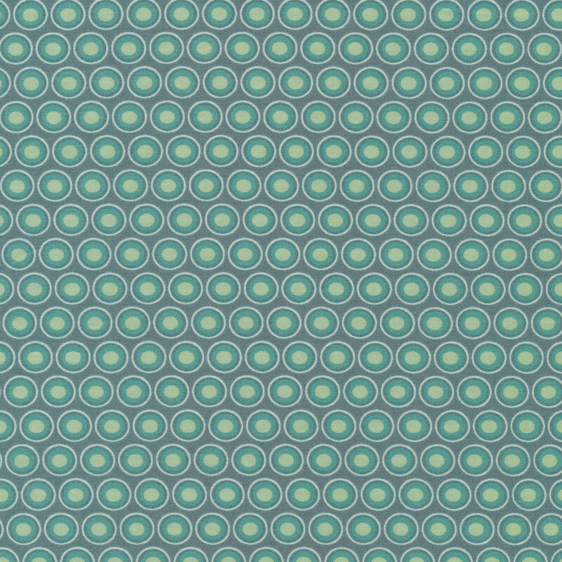 Pewter blue fabric with a lovely cream and aqua oval polka dot design