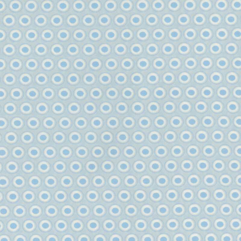 Pastel blue fabric with a lovely cream and blue oval polka dot design