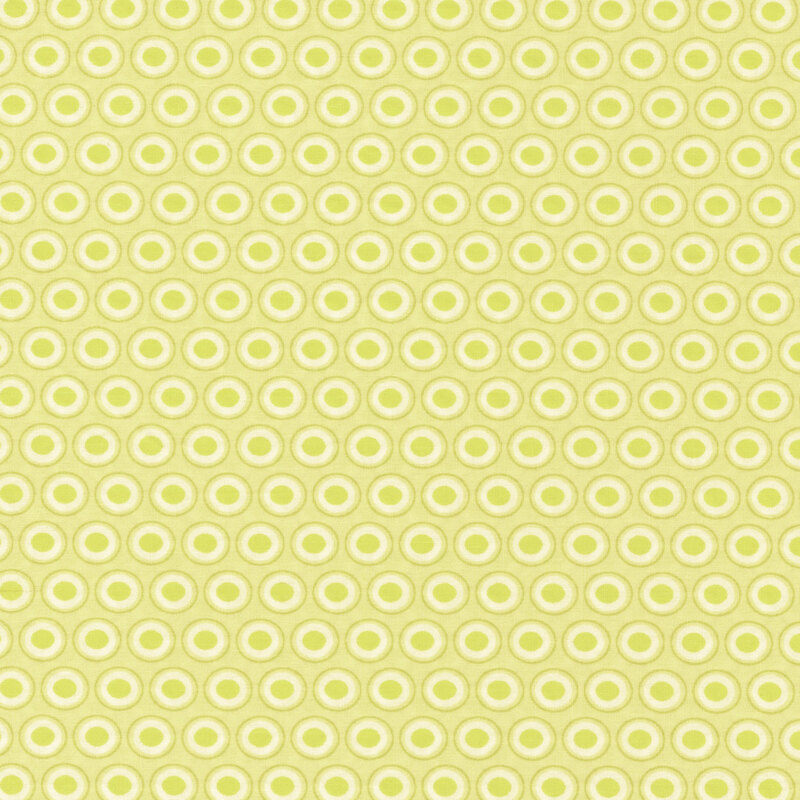 Pastel green fabric with a lovely cream and lime green oval polka dot design