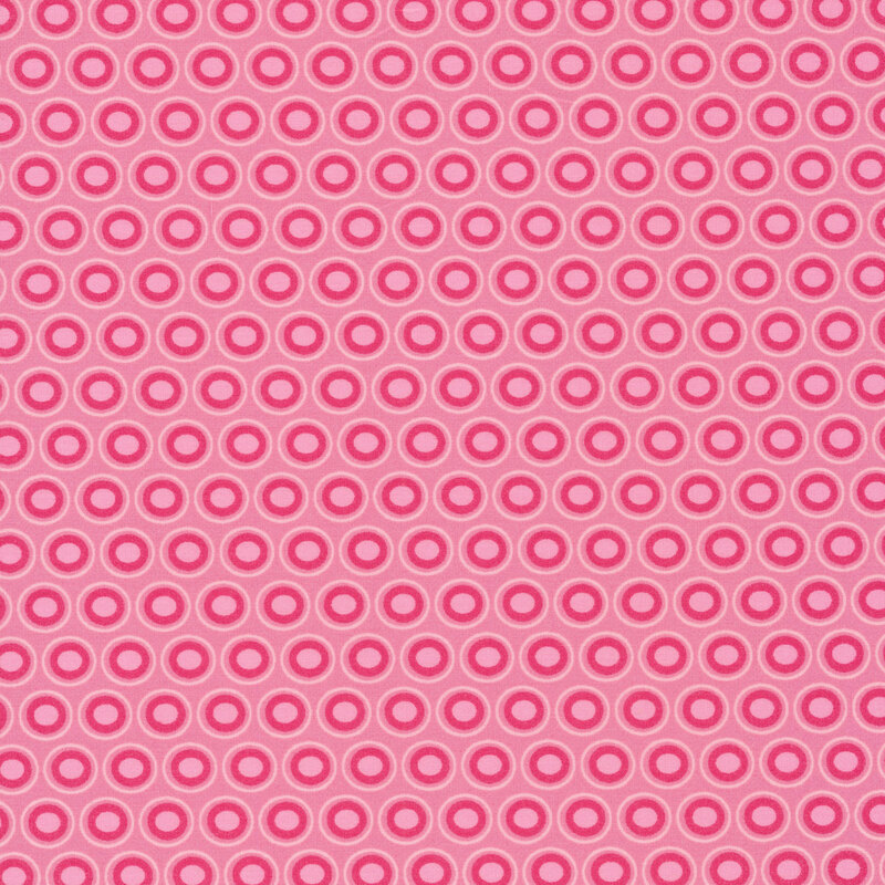 Pink fabric with a lovely fuchsia and light pink oval polka dot design