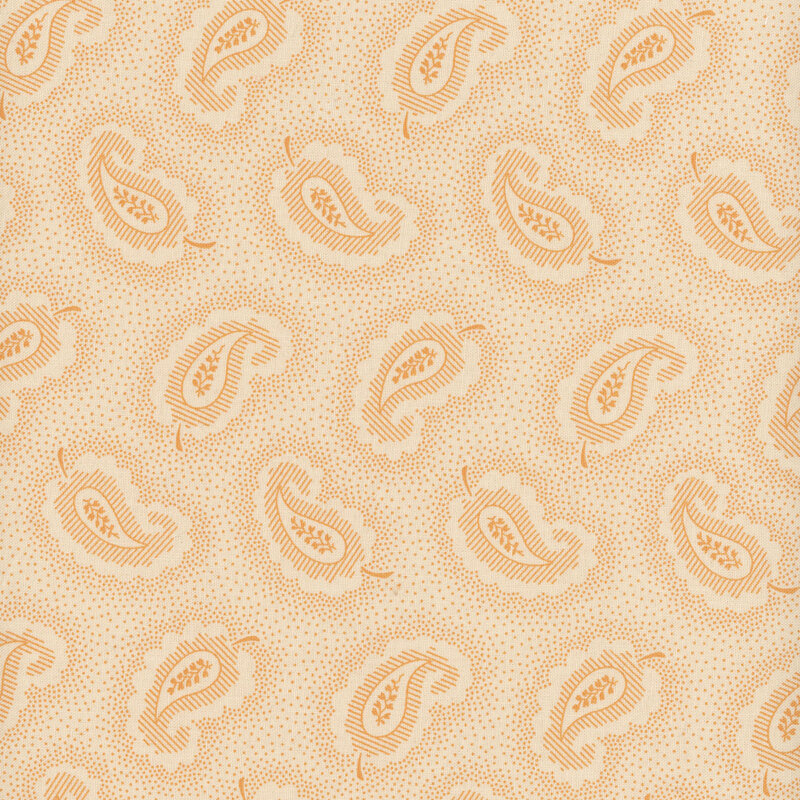 Cream fabric with orange leaf-shaped paisley shapes tossed all over