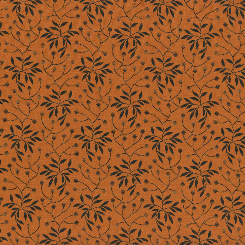 Orange fabric with black leafy vines all over