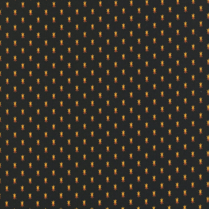 Black fabric with tiny orange and cream spiked motifs spaced evenly all over