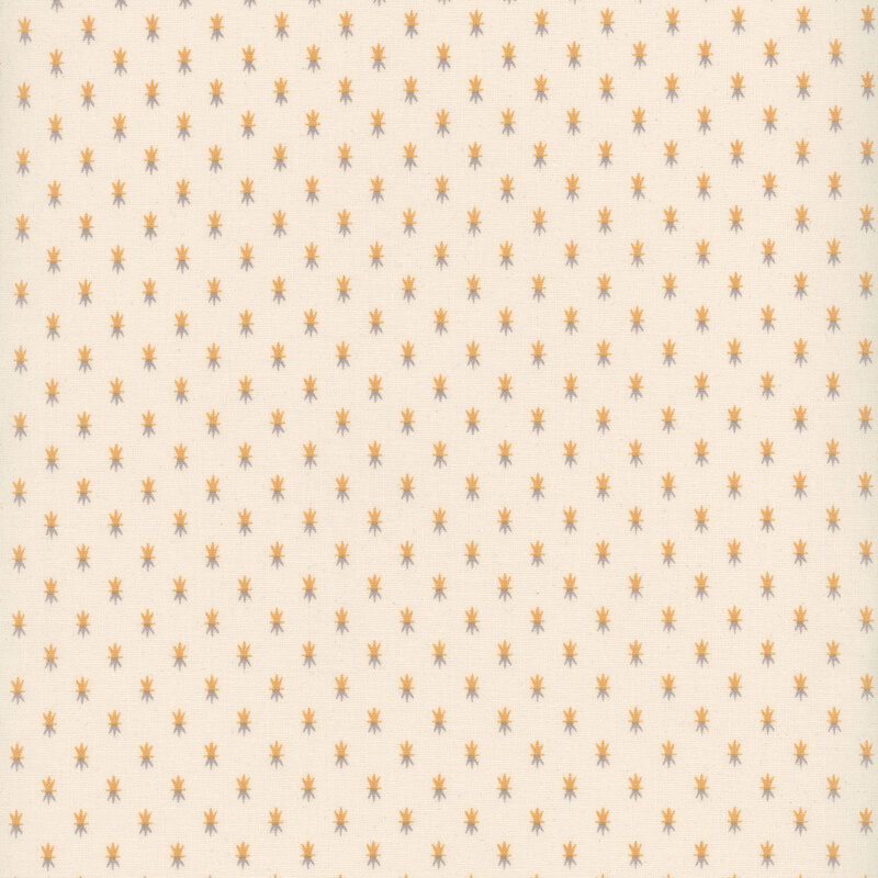 Cream fabric with tiny orange and gray spiked motifs spaced evenly all over