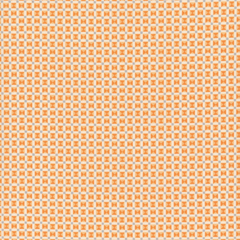 Orange, cream, and gray fabric made up of tiny triangles in a grid-like structure