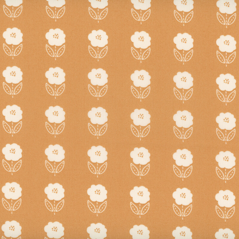 Peachy orange fabric with a uniform design of white flowers