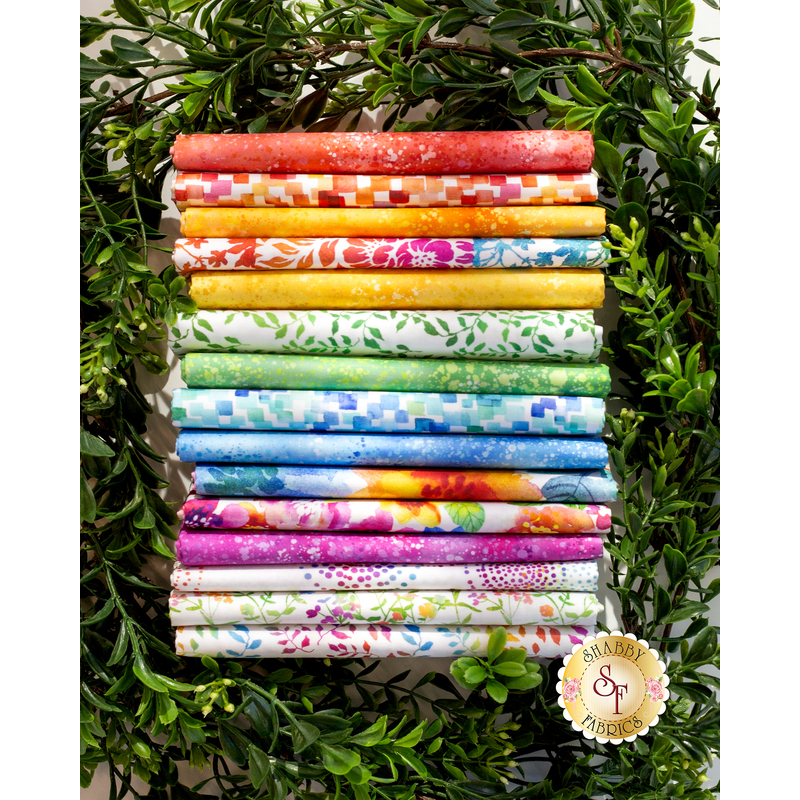 A photo of a stack of bright and colorful pinks, greens, blues, and yellows included in the Sew Spring collection.