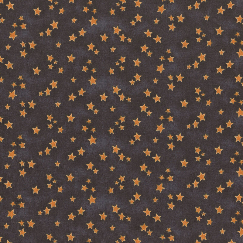 black mottled fabric featuring scattered orange stars