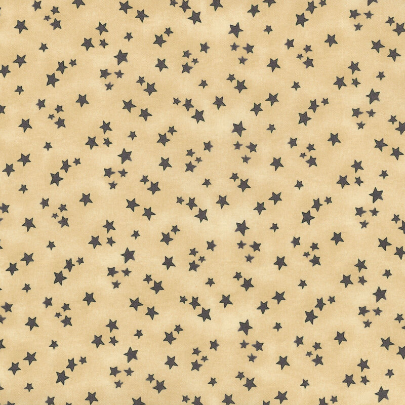 cream mottled fabric featuring scattered gray stars