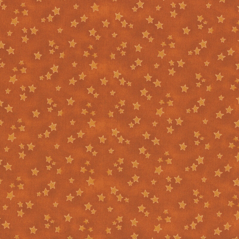 orange mottled fabric featuring scattered tonal light orange stars