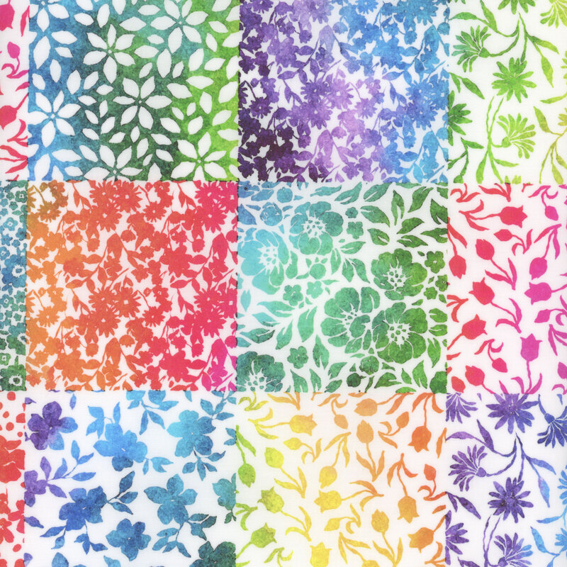 Small bright red, blue, yellow, and purple flowers in a patchwork pattern on white fabric.