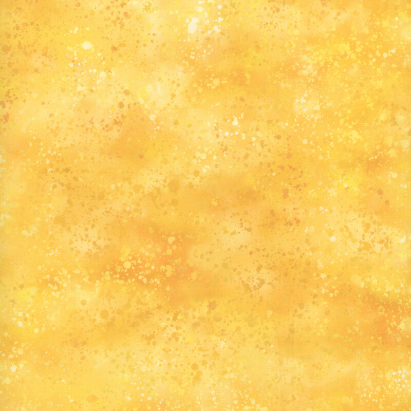 Yellow mottled fabric with a watercolor splatter effect.