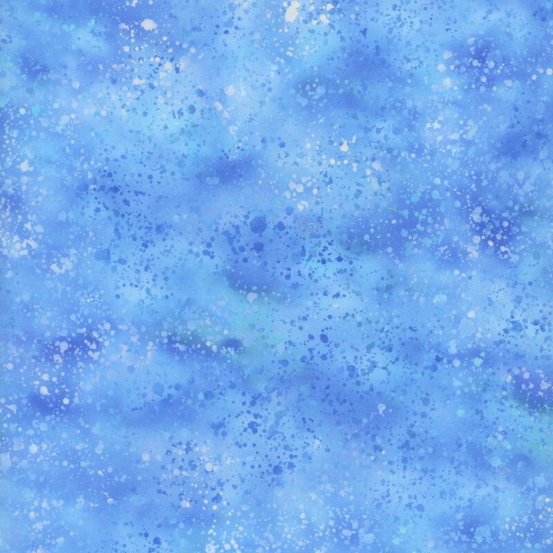 Blue mottled fabric with a watercolor splatter effect.