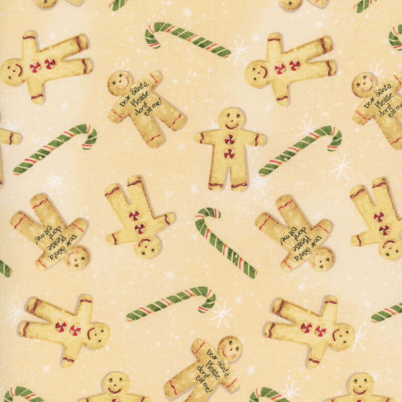 snowflake covered warm cream fabric adorned with scattered green candy canes and gingerbread cookies